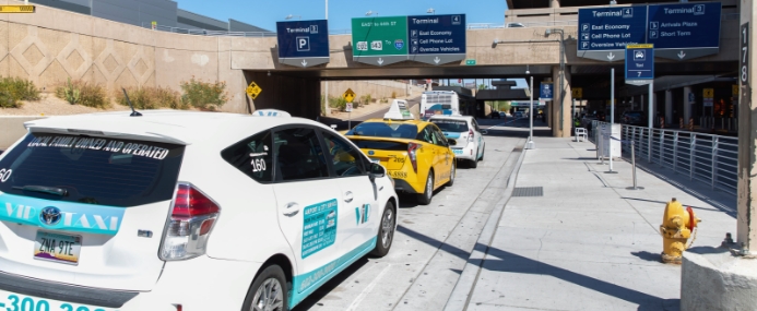 Line of taxi cabs outside the airport.