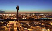 Overview shot of PHX Sky Harbor International Airport and its air traffic control tower at night. City of Phoenix Aviation Department Files Legal Action Against Tempe