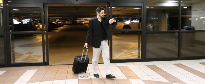 Man walking into parking garage.