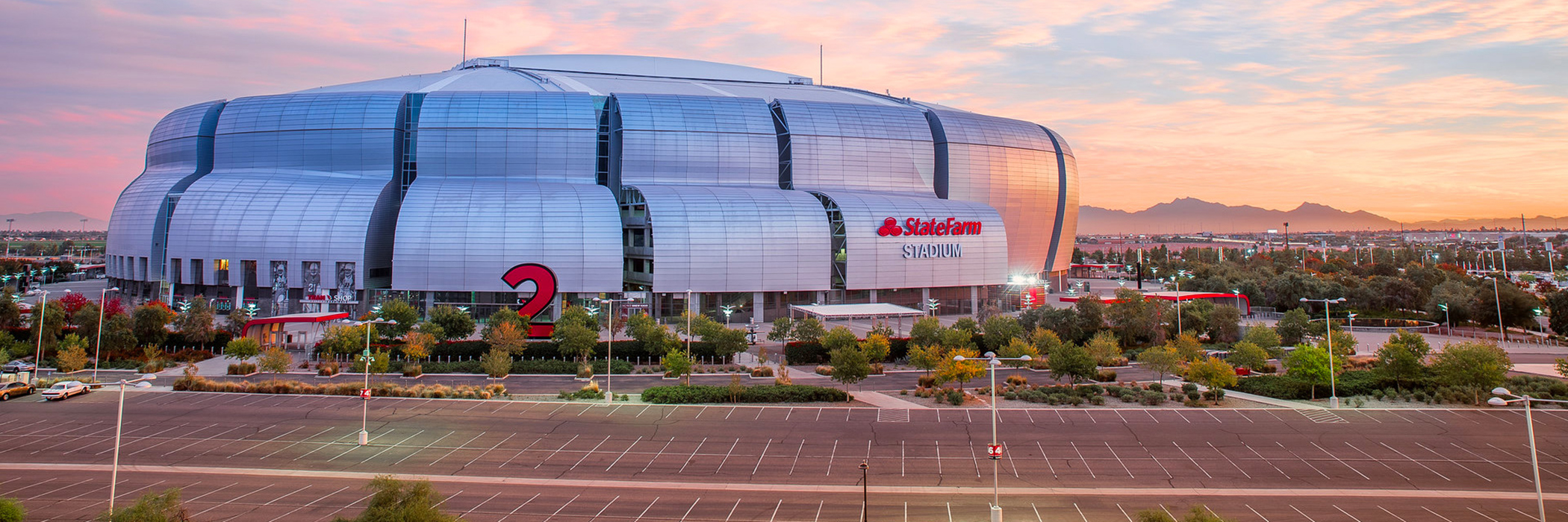 Exterior of State Farm Stadium at sunset.