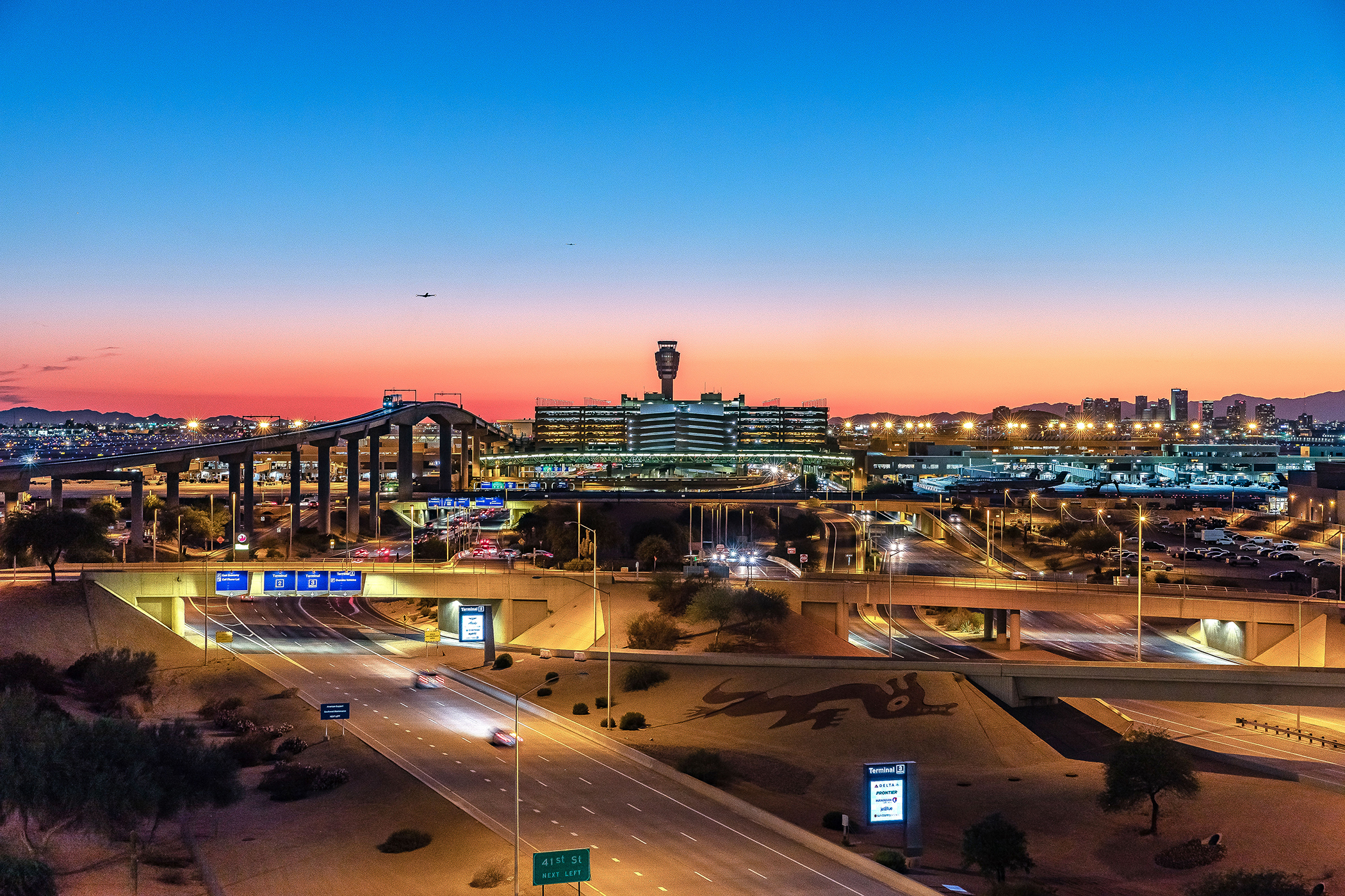 Exterior of PHX Sky Harbor International Airport at sunset.